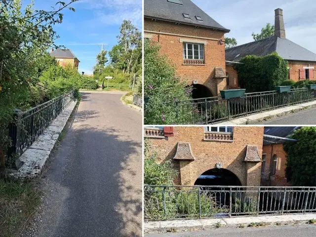 L'entrée du village au pont de Saint-Paër : rambardes rénovées et moulin en brique au bord de la Lévrière