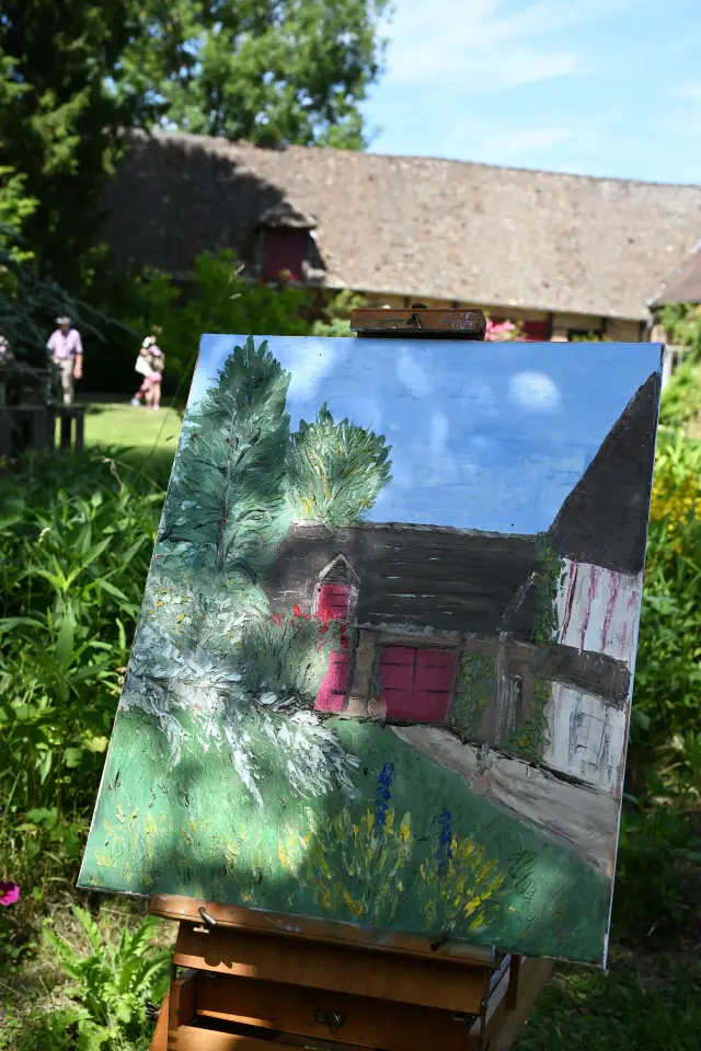 Toile sur chevalet représentant une maison normande